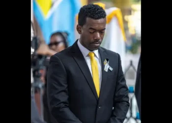 UWP candidate Rosh Clarke attends a funeral service in Castries, St Lucia