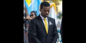 UWP candidate Rosh Clarke attends a funeral service in Castries, St Lucia