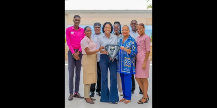 Janelle Hopkin and Lady Betty Hopkin celebrate AAA Five Diamond Award with Spice Island Beach Resort team in Grenada