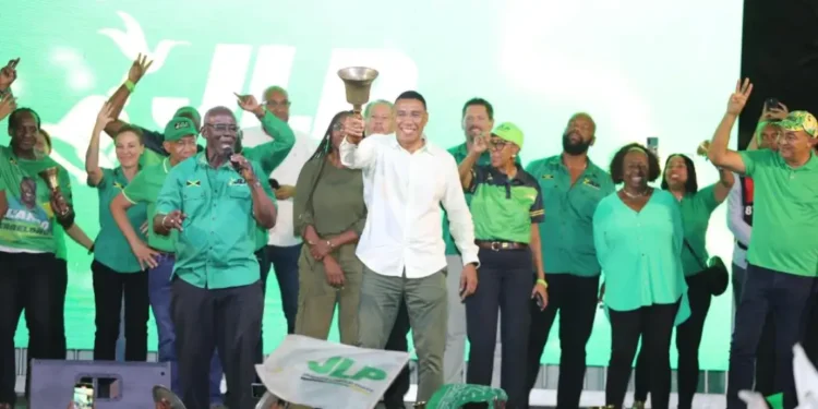 Andrew Holness secures third term as JLP wins nail-biting election, celebrating with supporters in Jamaica.