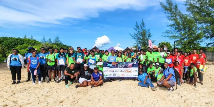 Volunteers gather at Yamacraw Beach for the Blue Lagoon Island coastal cleanup, marking 40 years of community action against marine debris.
