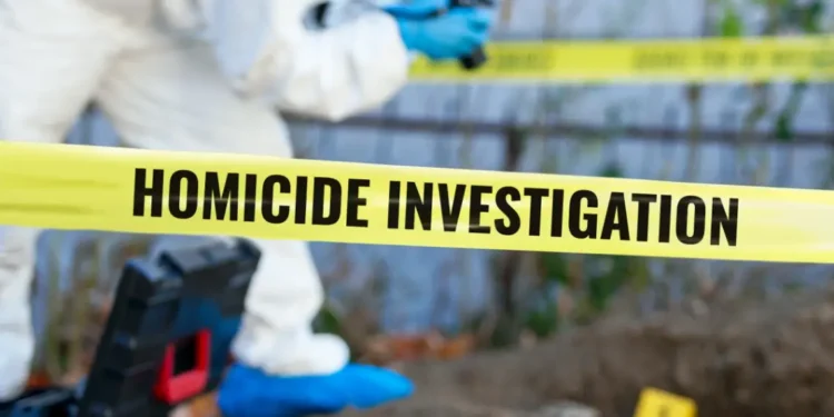 Depiction of a homicide investigation scene with police tape and forensic officer, referencing the burnt vehicle discovered in Canelles, St Lucia.