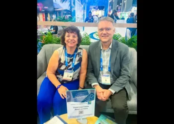 Beth Hatt of Aquila Center for Cruise Excellence with Randy Durband of GSTC promoting sustainable cruise tourism partnership at Seatrade Cruise Global 2025.