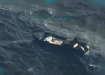 Aerial image showing the Trump Venezuela drug boat strike, with a targeted vessel in rough seas after the U.S. military operation