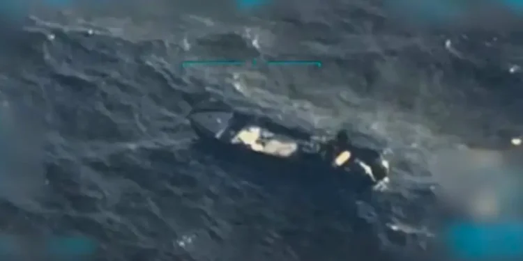 Aerial image showing the Trump Venezuela drug boat strike, with a targeted vessel in rough seas after the U.S. military operation