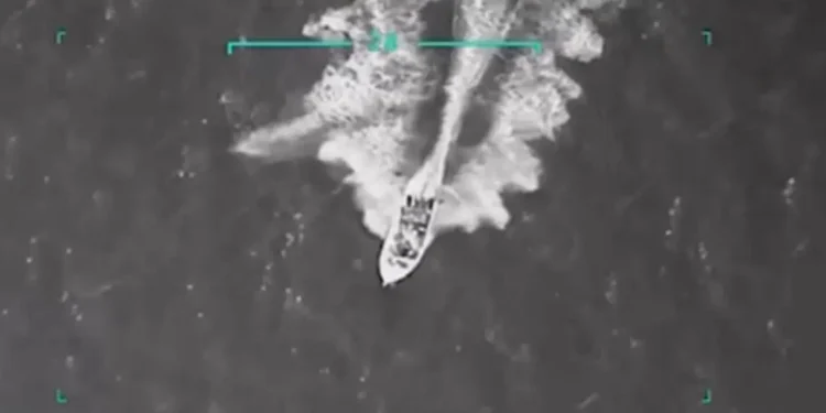 Aerial surveillance image shows US strike on Venezuelan drug boat in Caribbean waters before it was destroyed, killing 11