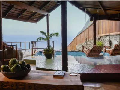 Open-air suite with private plunge pool at Ladera Resort in St Lucia, offering panoramic Piton views – Forbes ranks best resorts in St Lucia
