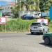 UWP candidate Marcella Johnson overlaid on Gros Islet Corinth back road scene where No Right Turn signs sparked commuter backlash