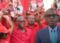 Philip J Pierre and Stanley Felix amid Labour Party crowd in Saint Lucia following betrayal remarks controversy.