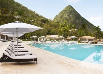 Poolside view at Sugar Beach resort in St Lucia with Pitons in the background – Forbes ranks best resorts in St Lucia