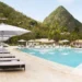 Poolside view at Sugar Beach resort in St Lucia with Pitons in the background – Forbes ranks best resorts in St Lucia