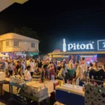 Crowd gathered at the Gros Islet Friday Night Street Party with vendors and visitors enjoying the nightlife scene.