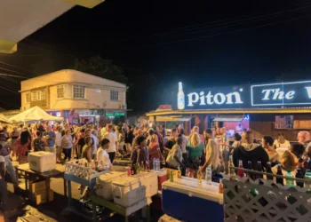 Crowd gathered at the Gros Islet Friday Night Street Party with vendors and visitors enjoying the nightlife scene.