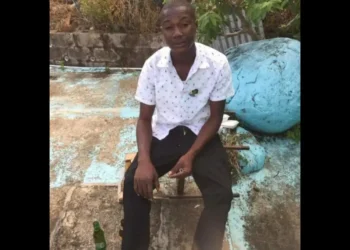 A man later killed in a fatal stabbing in Dennery Village is seen seated outdoors in an undated photo.