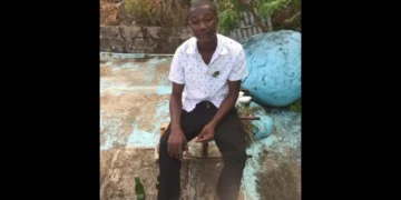A man later killed in a fatal stabbing in Dennery Village is seen seated outdoors in an undated photo.