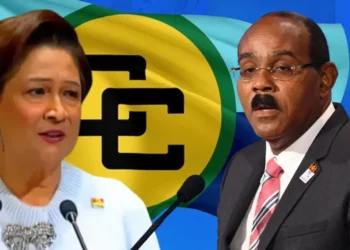 Kamla Persad-Bissessar and Gaston Browne appear against a Caricom flag as Kamla rejects Caricom zone of peace