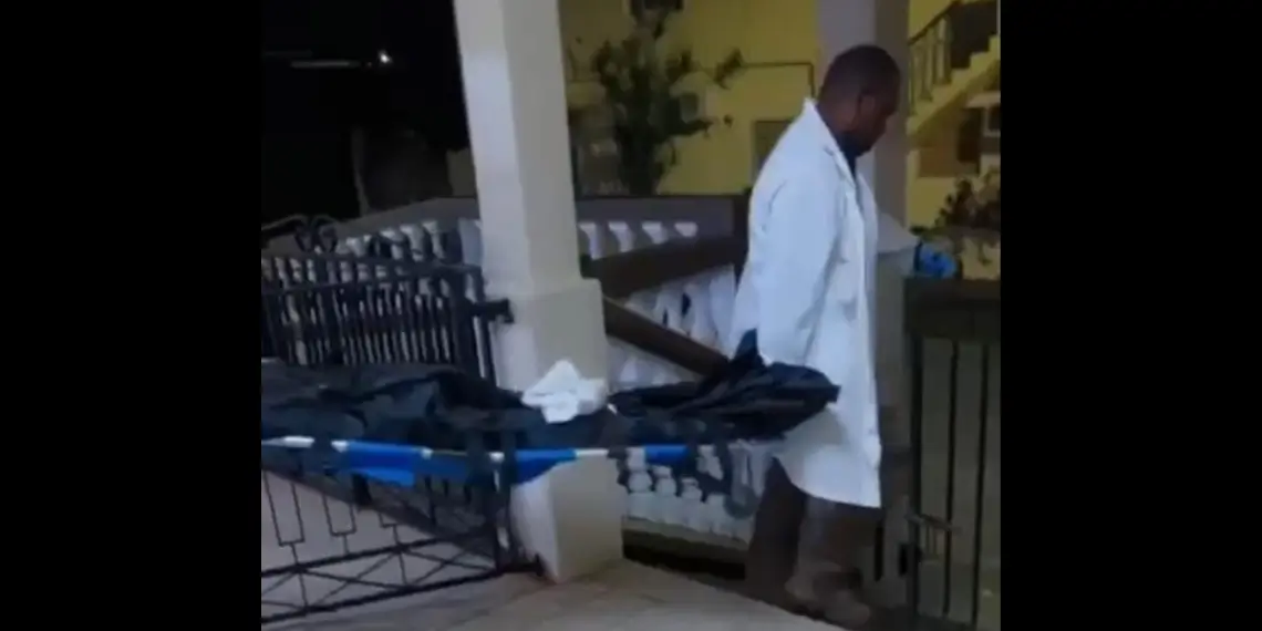 Emergency personnel remove the body of a Choiseul man fatally shot in Soufriere following the Palmiste shooting.