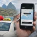 A licensed taxi driver in St Lucia beside his vehicle while a smartphone displays the Uber app during Uber registration in St Lucia.