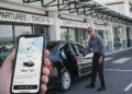 Uber launches in St Lucia as a taxi driver waits at an airport while a ride is booked on a mobile app