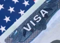 US visa bonds highlighted on a United States visitor visa document amid travel policy concerns
