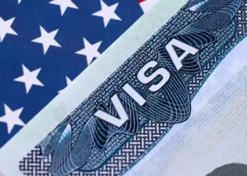 US visa bonds highlighted on a United States visitor visa document amid travel policy concerns