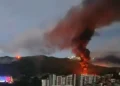 Fire and smoke rise over Caracas following reports linked to the US strike in Venezuela.
