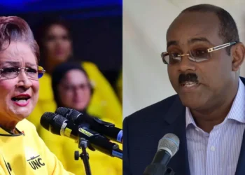Split image shows two Caribbean political leaders speaking at separate events as Gaston Browne defends Caricom stance amid regional tensions.