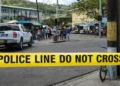 Police tape and patrol vehicle on Jeremie Street in Castries where a Soufriere resident fatally stabbed