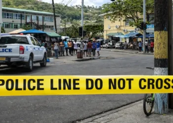 Police tape and patrol vehicle on Jeremie Street in Castries where a Soufriere resident fatally stabbed