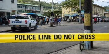 Police tape and patrol vehicle on Jeremie Street in Castries where a Soufriere resident fatally stabbed