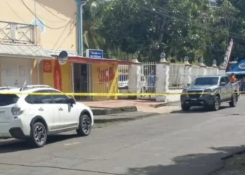 Police tape secures the area outside La Clery supermarket following an attempted robbery investigation