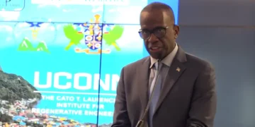 Prime Minister Philip J. Pierre addressing an international health conference where Cuba medical training ban was discussed