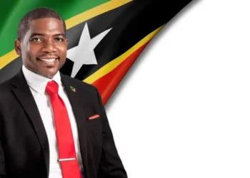 Prime Minister Terrance Drew portrait with St Kitts and Nevis flag, St Kitts and Nevis US deportees story