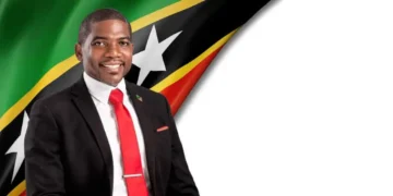 Prime Minister Terrance Drew portrait with St Kitts and Nevis flag, St Kitts and Nevis US deportees story