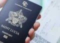St Lucia passport upgrade illustrated by Saint Lucian passport in hand