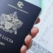 St Lucia passport upgrade illustrated by Saint Lucian passport in hand