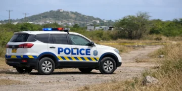 Police vehicle in the Beanfield area of Vieux Fort where a decomposing body found in Vieux Fort is under investigation