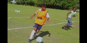 Young female footballer controls the ball during training ahead of CONCACAF Under 17 Women Qualifiers