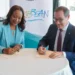 Dona Regis-Prosper and Rafael Echevarne sign the CTO ACI-LAC agreement in Bermuda to strengthen Caribbean air connectivity.