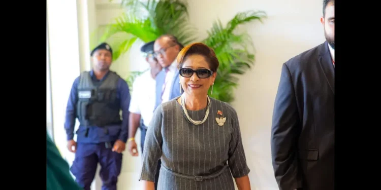 Kamla Persad-Bissessar arriving at the CARICOM Summit with security detail