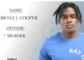 Merkyle Cooper, one of 2 suspects charged in Tixcy murder, shown in a police-issued custody photograph