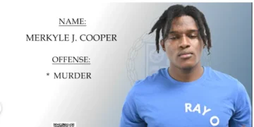 Merkyle Cooper, one of 2 suspects charged in Tixcy murder, shown in a police-issued custody photograph