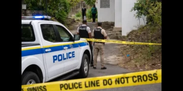Representative image of police officers securing a scene during the Barre Du Chaussee death investigation in Castries.