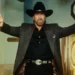 Chuck Norris dies at 86 as the Walker, Texas Ranger star appears in a doorway wearing a black cowboy hat