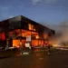 Computer World fire burns through the commercial building in Bois d’Orange as firefighters respond at night