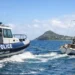 Police Marine Unit Assists Distressed Vessel off Gros Islet as officers tow capsized sailboat safely ashore