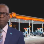 Prime Minister Philip J. Pierre pictured in front of a gas station as Pierre Warns of Fuel Price Impact amid scrutiny over fuel prices in St Lucia.