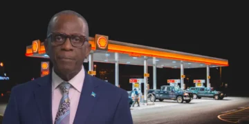 Prime Minister Philip J. Pierre pictured in front of a gas station as Pierre Warns of Fuel Price Impact amid scrutiny over fuel prices in St Lucia.