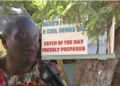 Marie Fish Shack eviction dispute as Marie speaks during an interview in front of her sign at Reduit Beach in St Lucia