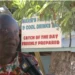 Marie Fish Shack eviction dispute as Marie speaks during an interview in front of her sign at Reduit Beach in St Lucia